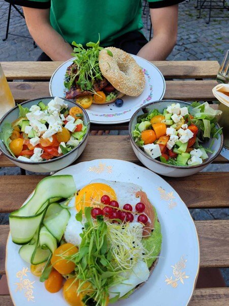 Bagel with salmon and egg and one with bacon and salad at LEAF in Aalst