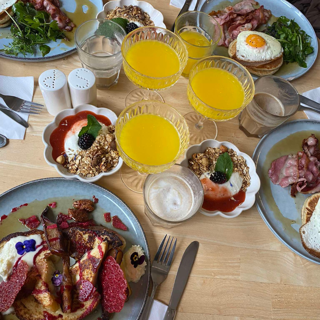 French toast and salty pancakes with orange juices.