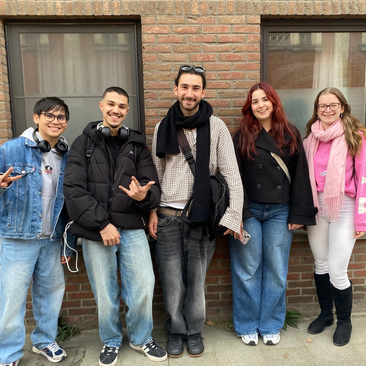 The 5 group members standing on a sidewalk in Gent
