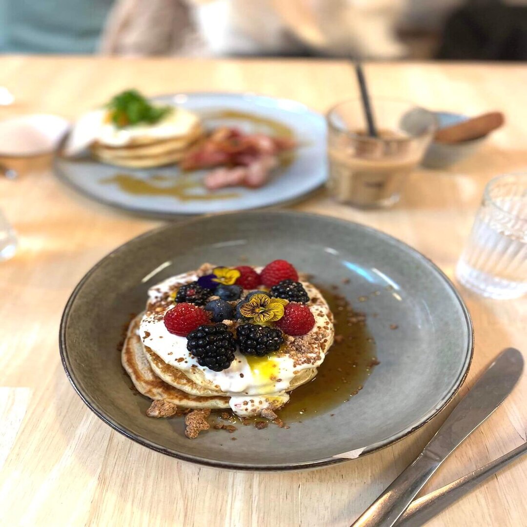 Fluffy pancakes with white chocolate and passion fruit syrup at Gust 