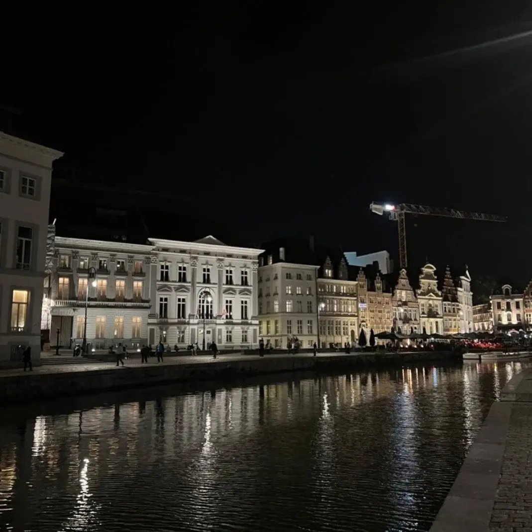 Night view of the Graslei and Korenlei waterfront and canal in Ghent, Belgium