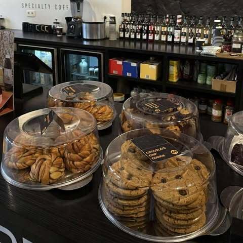 Different types of pastries covered with a glass dome