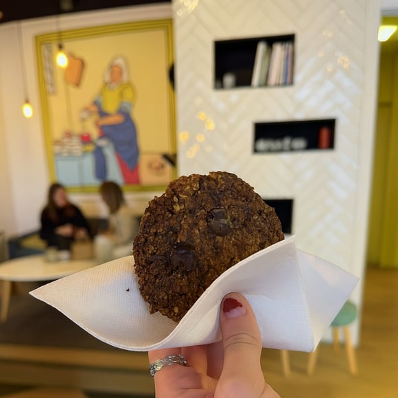 Chocolate vegan cookie in front of the interieur