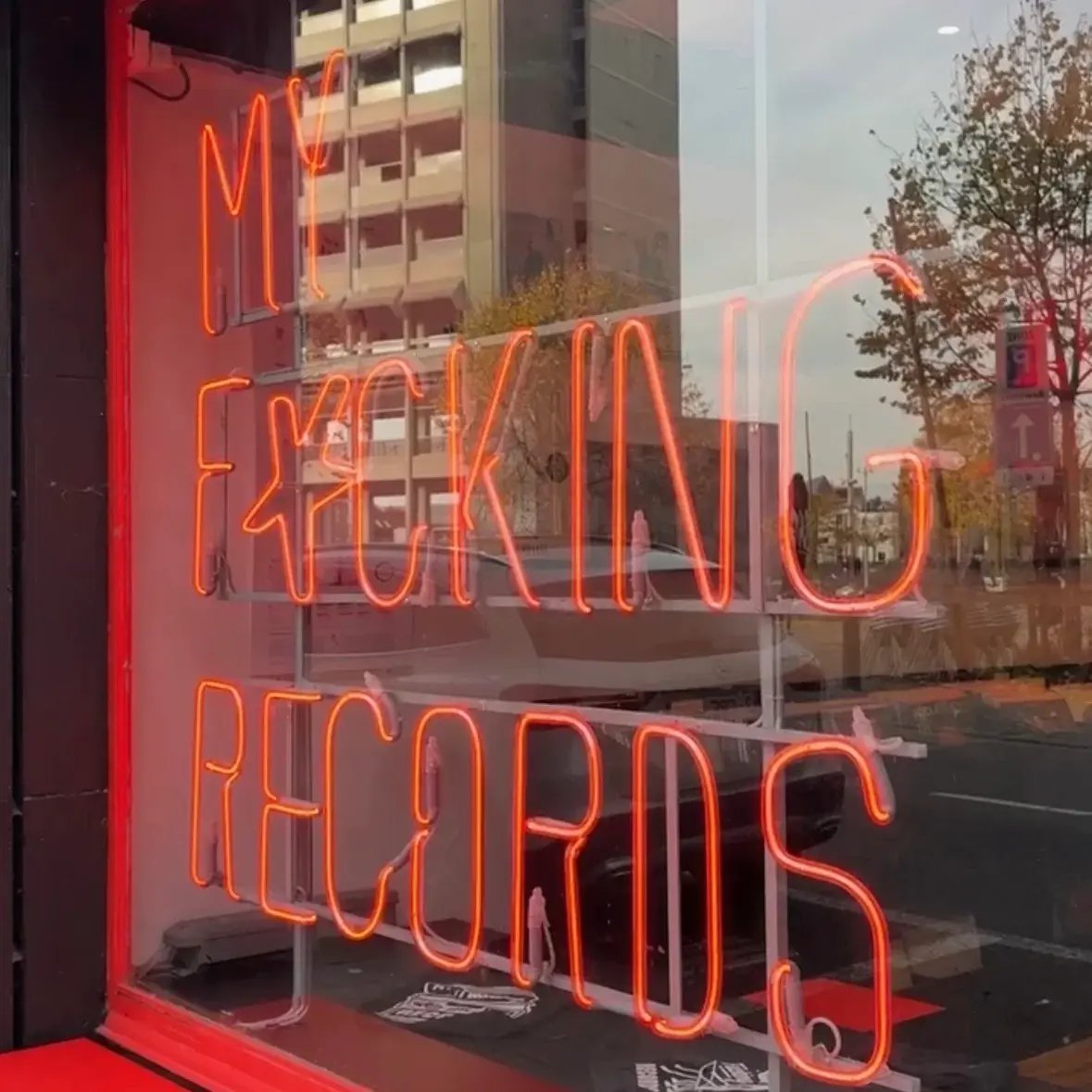 Red LED letters that spell "My fucking records" in the window