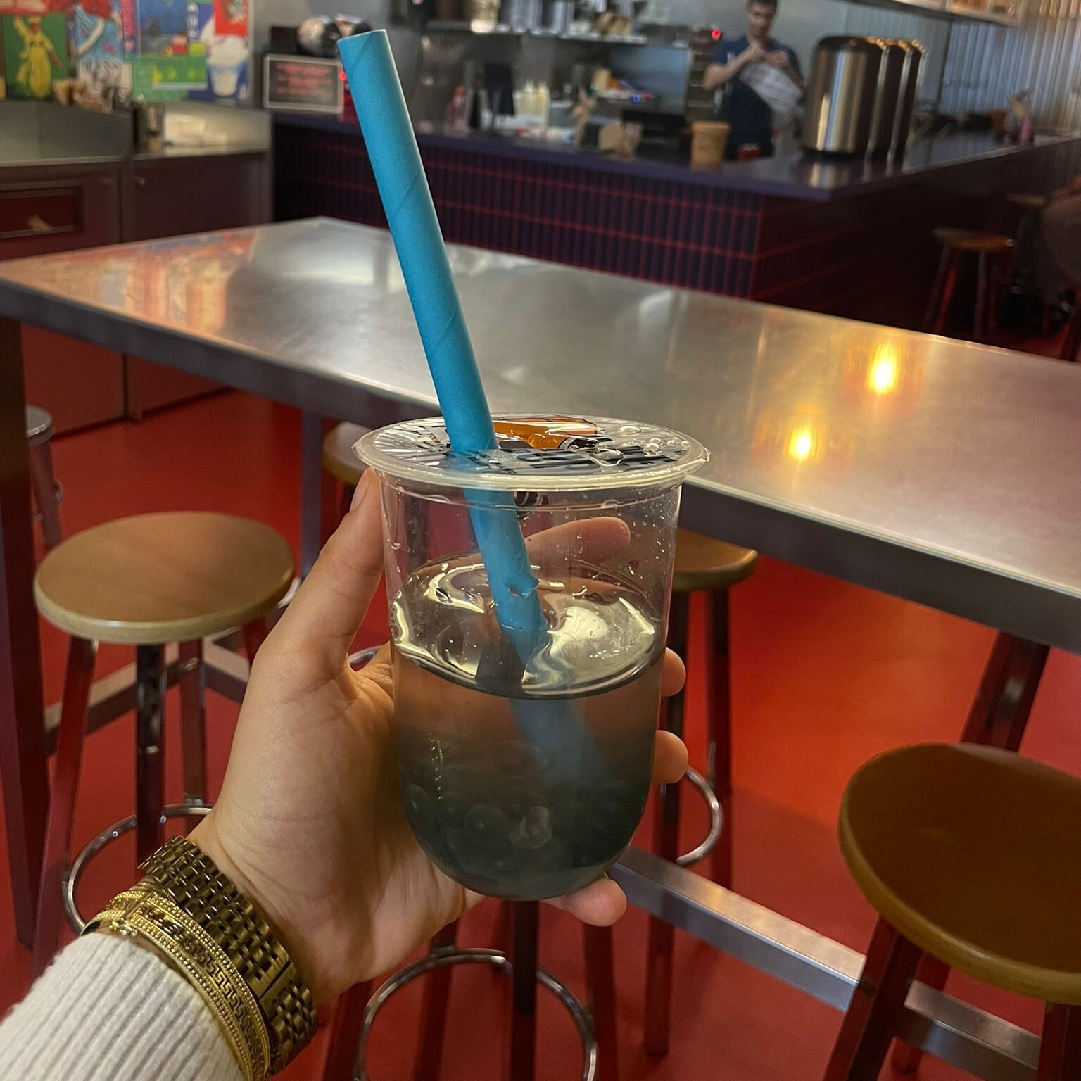 woman holding a Bubble Tea Strawberry & Passionfruit Seoul South Station