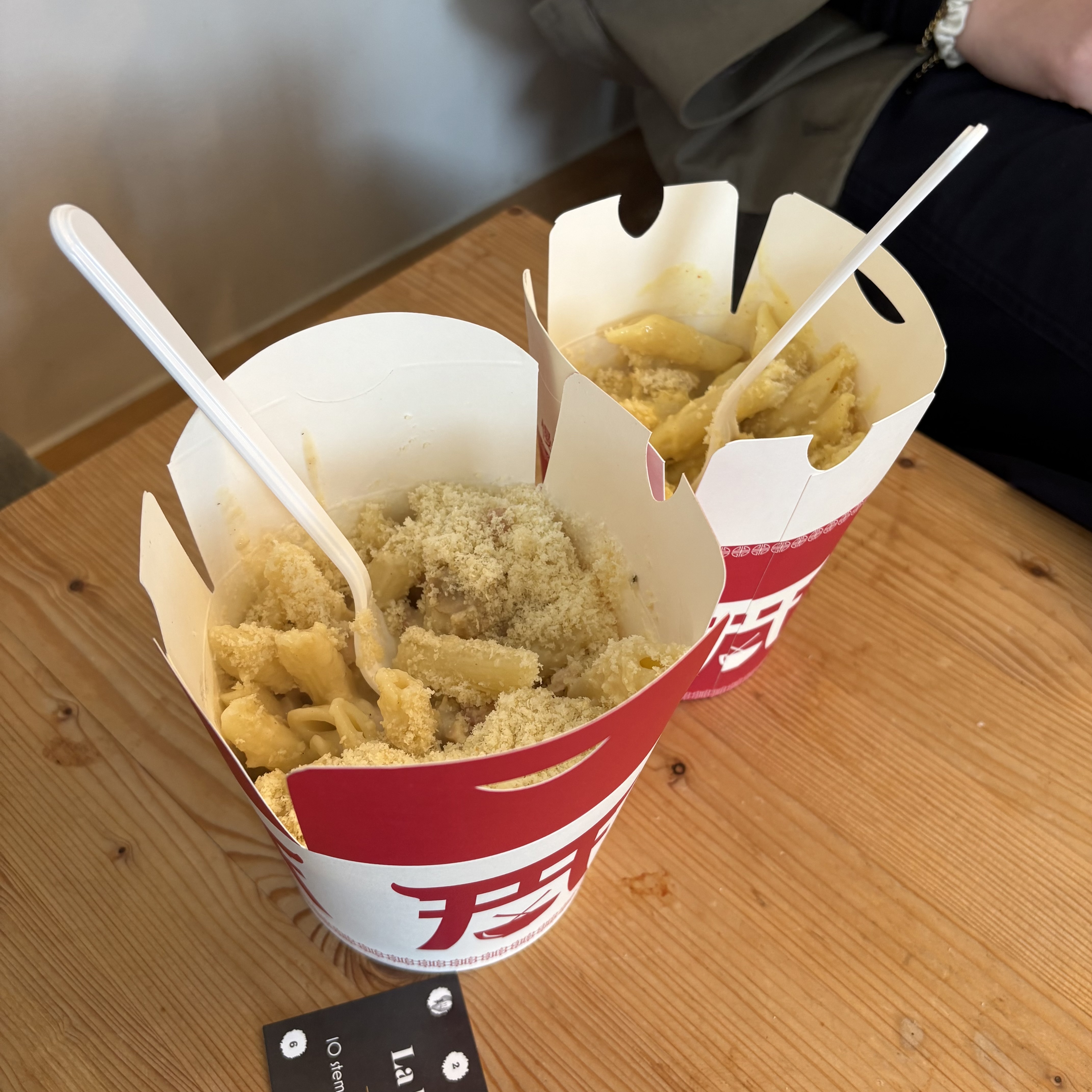 Two boxes of pasta on a table in pastabar La Bicyclette